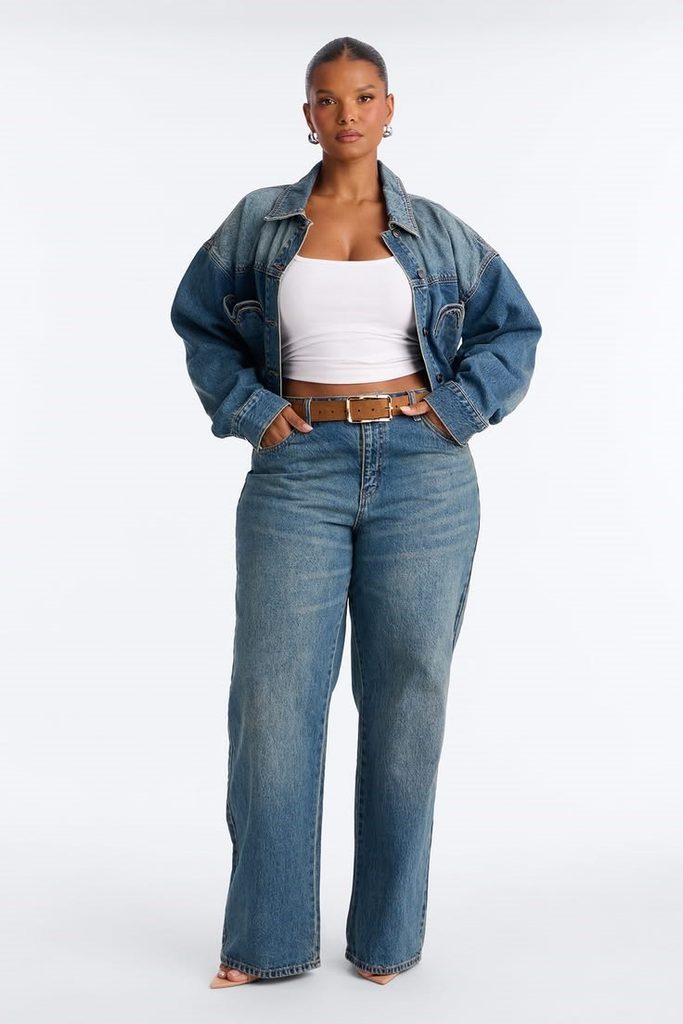 Plus size woman wearing straight-leg jeans with a denim jacket