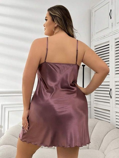 Plus size satin slip dress showing a smooth fit and adjustable straps