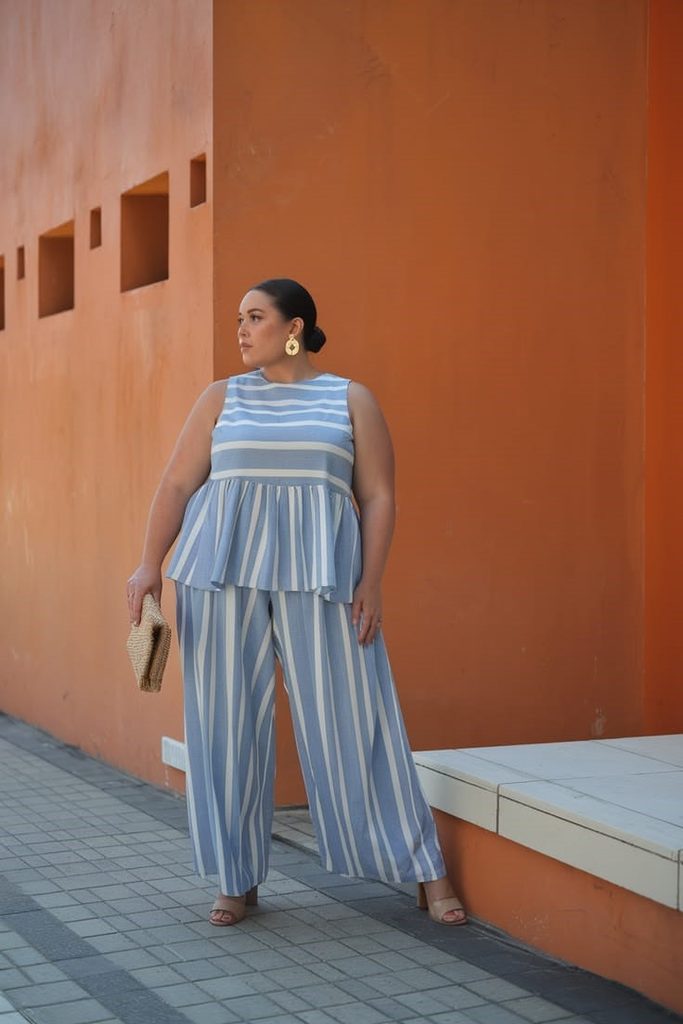 plus size woman wearing horizontal and vertical striped outfit
