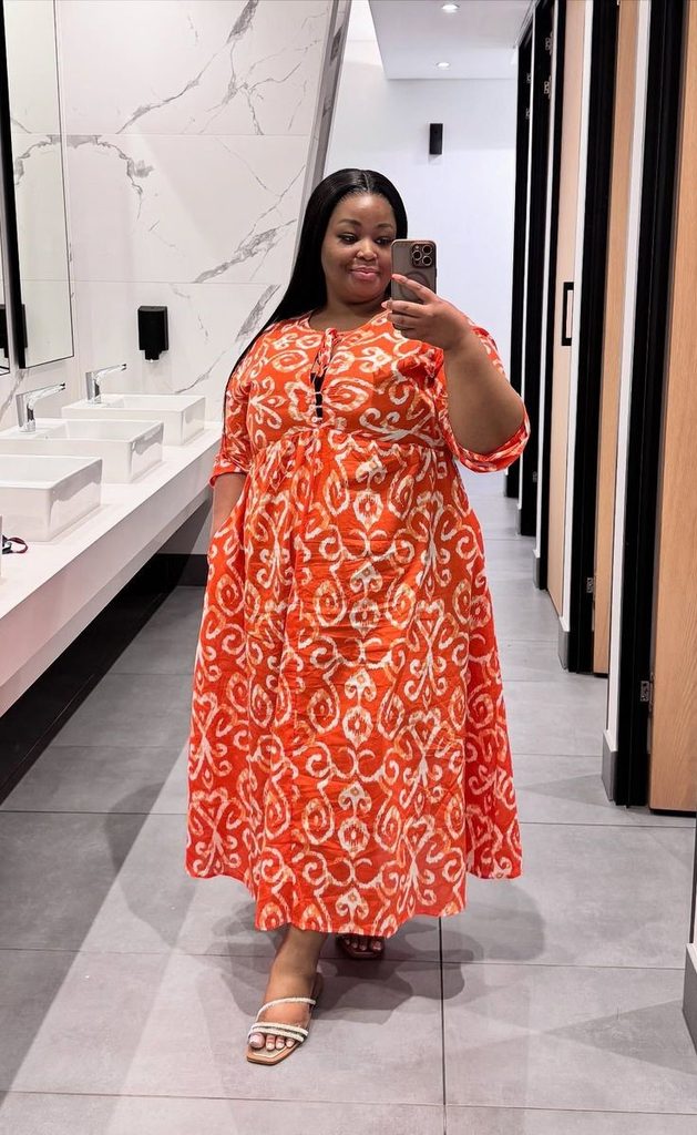 Why some clothes make you look bigger: plus size woman in a loose printed dress