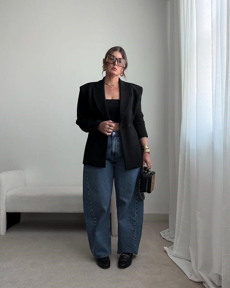 Why some clothes make you look bigger: plus size woman wearing a structured black blazer with jeans