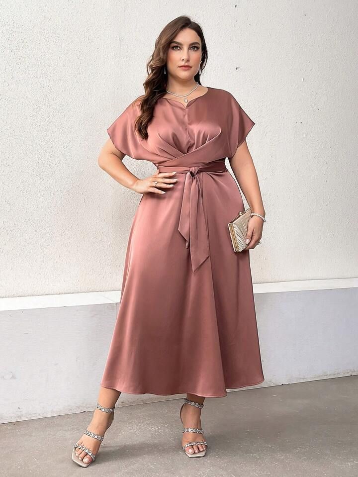 Birthday Dinner Outfit Ideas for Plus Size Women featuring a dusty rose satin midi dress with batwing sleeves and a waist tie