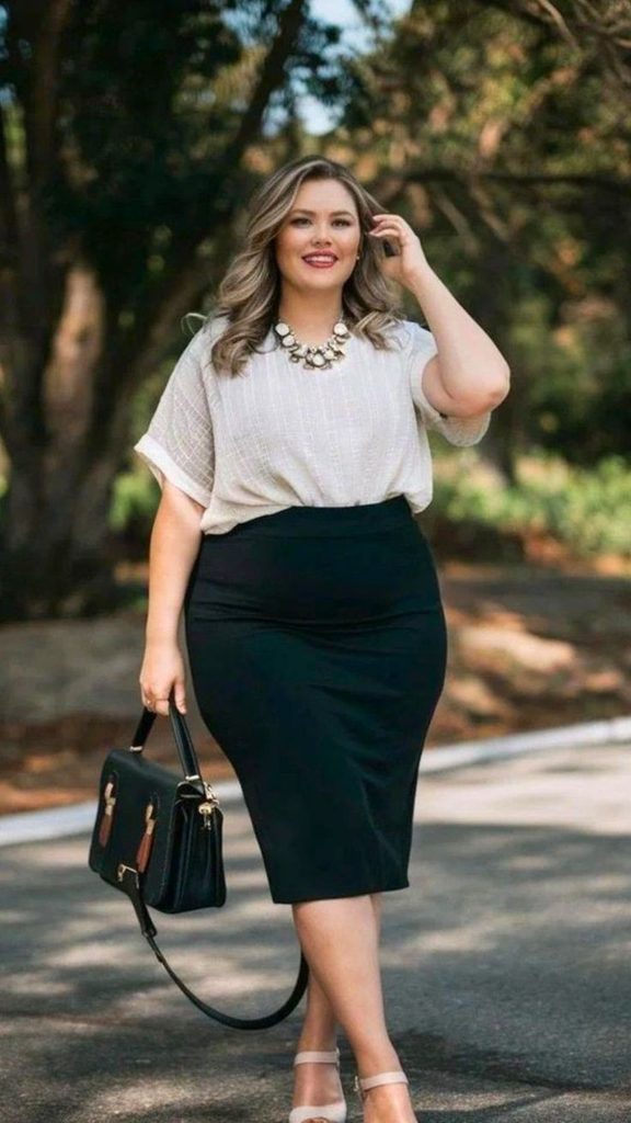 Business casual outfits for plus size women featuring a black pencil skirt and an elegant blouse.