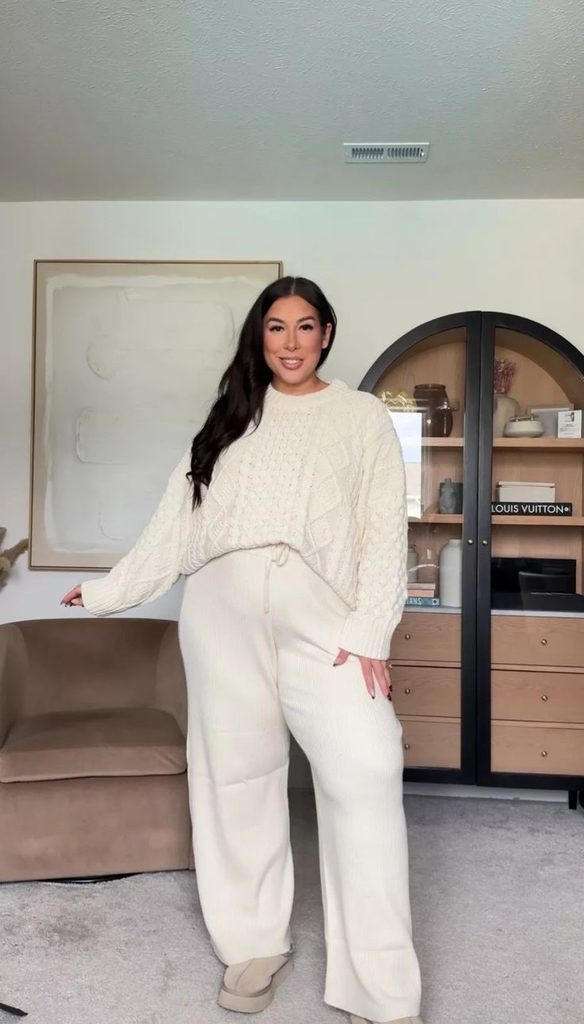 Cozy fall outfit for curvy women featuring a cream cable-knit sweater, matching wide-leg knit trousers, and beige shoes
