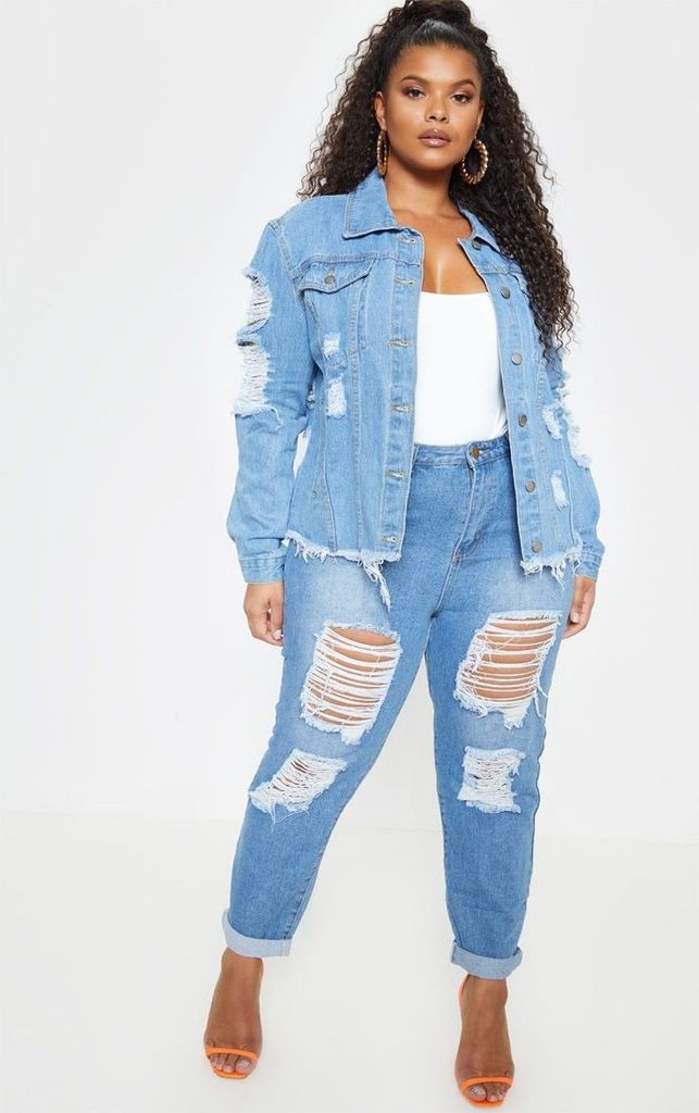 Plus size denim jacket outfit with a white top and distressed blue jeans.