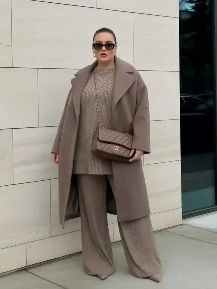 Long coat outfit ideas featuring a taupe long coat, matching ribbed knit sweater and wide-leg trousers