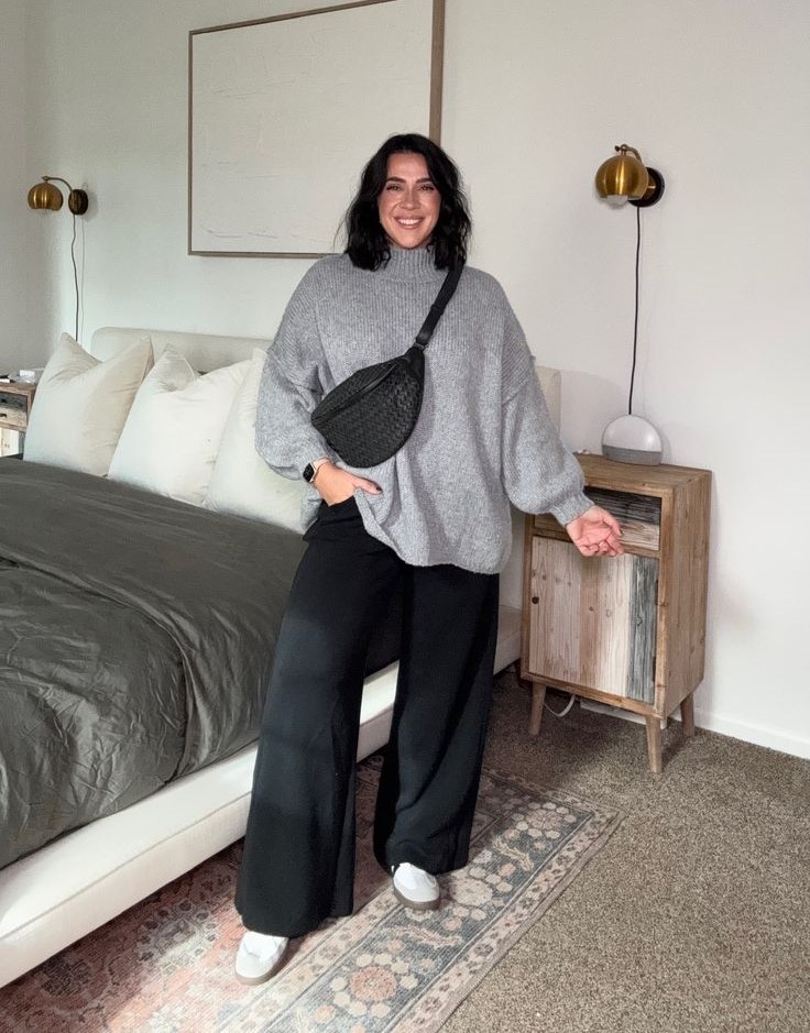 Neutral Outfit Ideas featuring black wide-leg trousers, an oversized gray knit sweater, white sneakers, and a black crossbody bag.