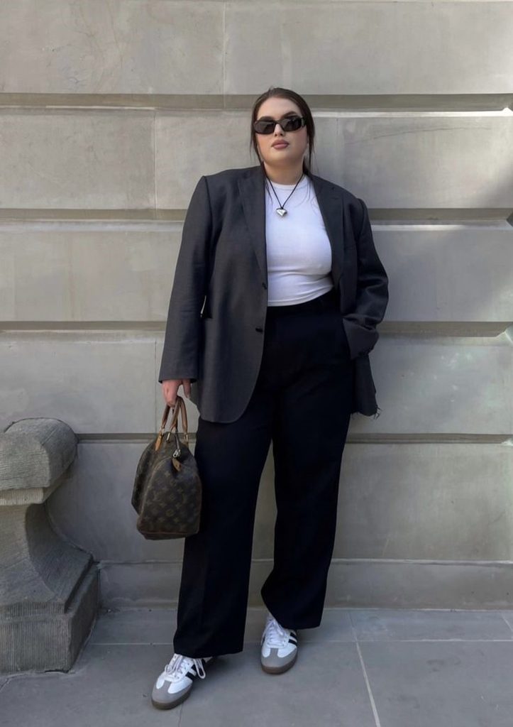 Neutral Outfit Ideas featuring a charcoal gray blazer, white fitted top, black wide-leg trousers, white sneakers, and a brown handbag.