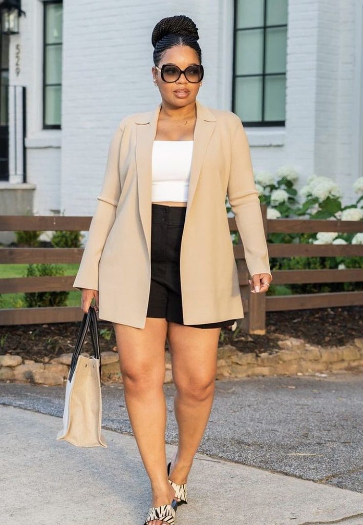 Neutral outfit ideas featuring a cream blazer, white crop top, black tailored shorts, and a beige tote bag.