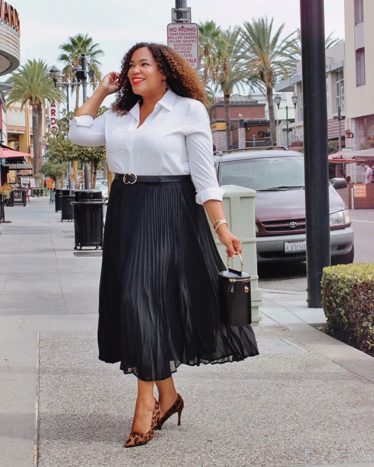 Neutral Outfit Ideas featuring a white button-down shirt, black pleated maxi skirt, black handbag, and leopard-print heels.