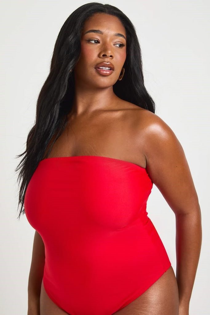 Plus size red bandeau swimsuit with a strapless neckline.