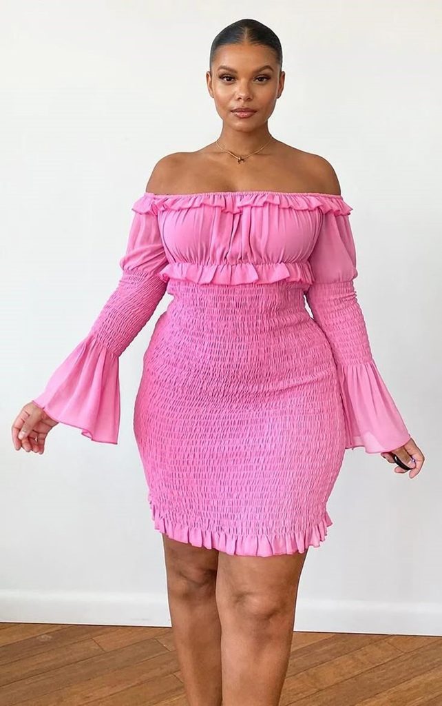 Plus size birthday dinner outfit featuring a pink off-shoulder bodycon dress with statement sleeves