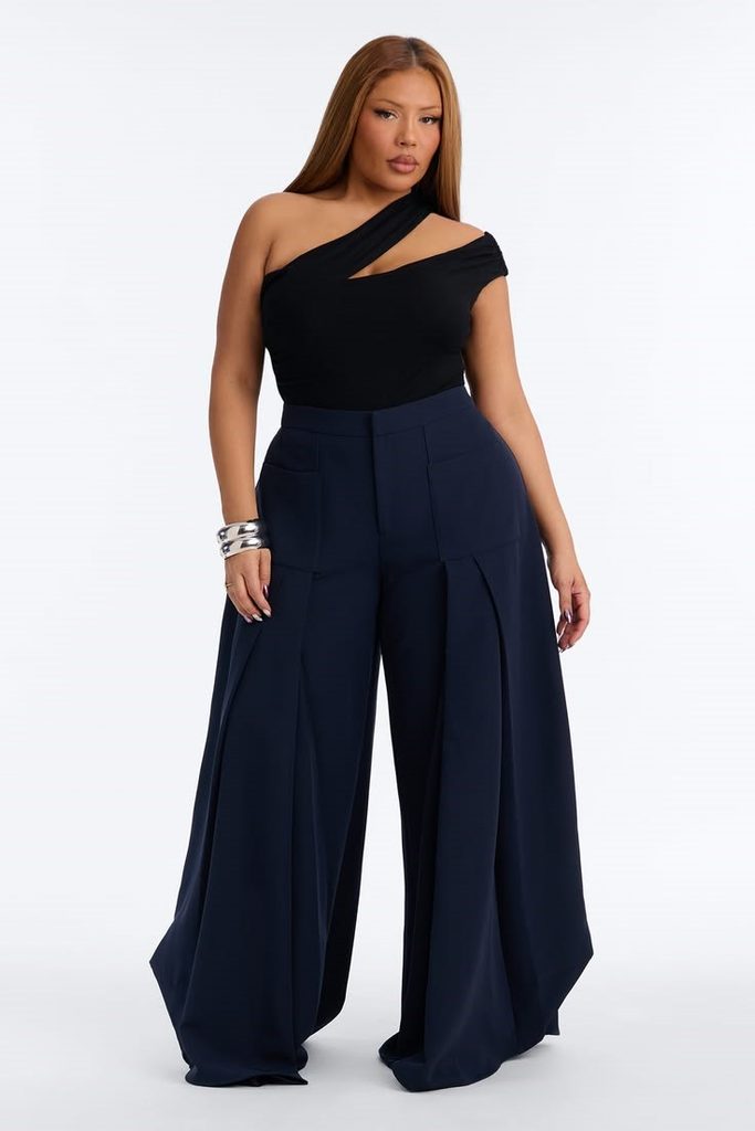Plus size birthday dinner outfit featuring navy wide-leg trousers and a black statement top