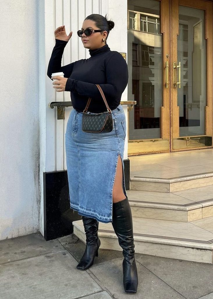 Plus size fall outfit with a black turtleneck, denim midi skirt, and black knee-high boots