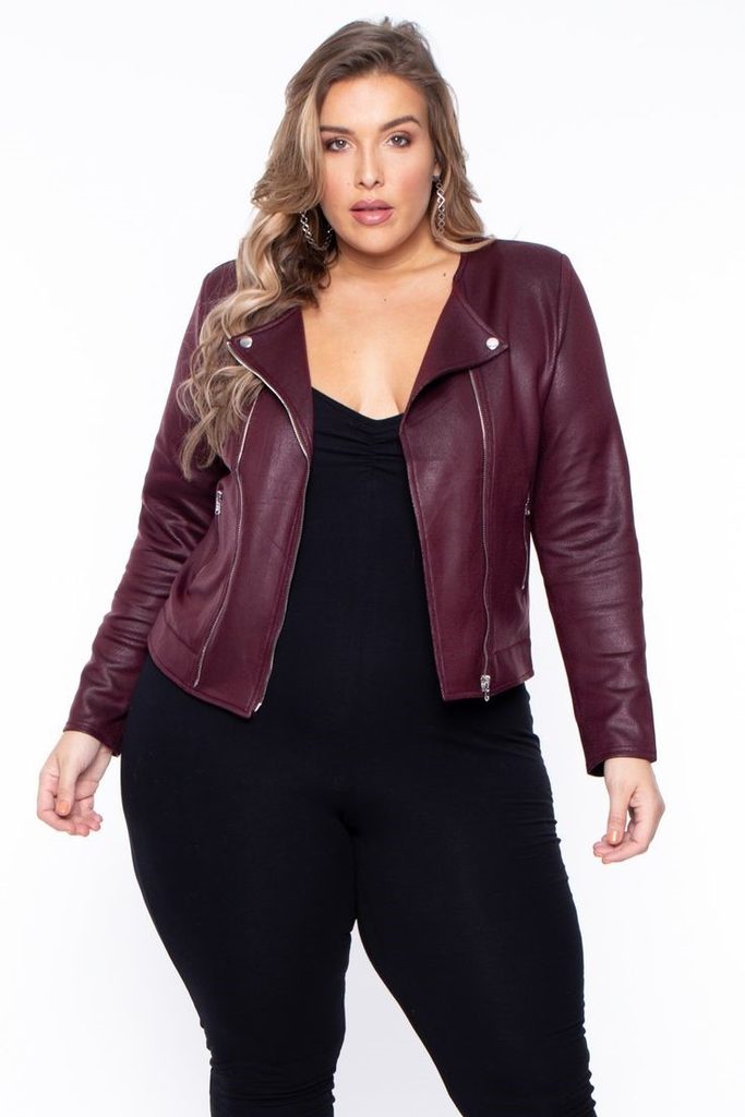 Plus size leather jacket outfit ideas featuring a burgundy leather jacket styled with a black jumpsuit