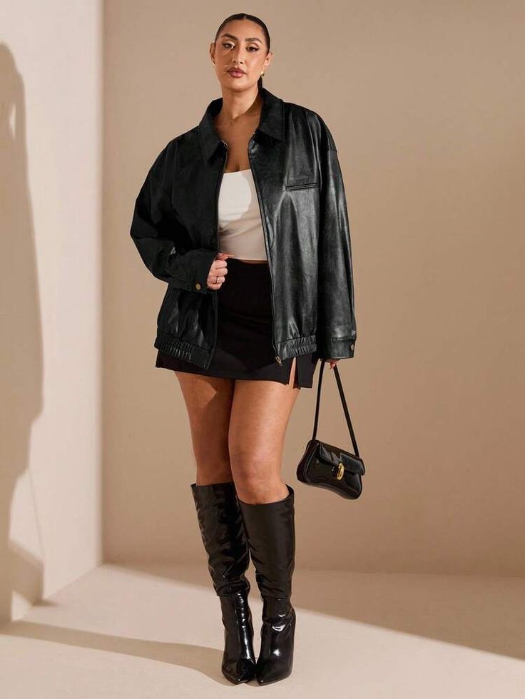 Plus size leather jacket outfit ideas featuring an oversized black leather jacket, mini skirt, white top, and knee-high boots