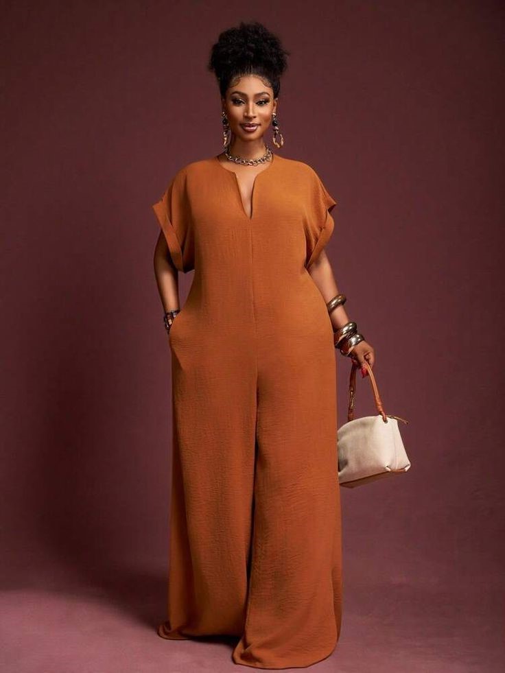 Plus size minimalist fashion featuring a neutral casual jumpsuit and simple accessories.