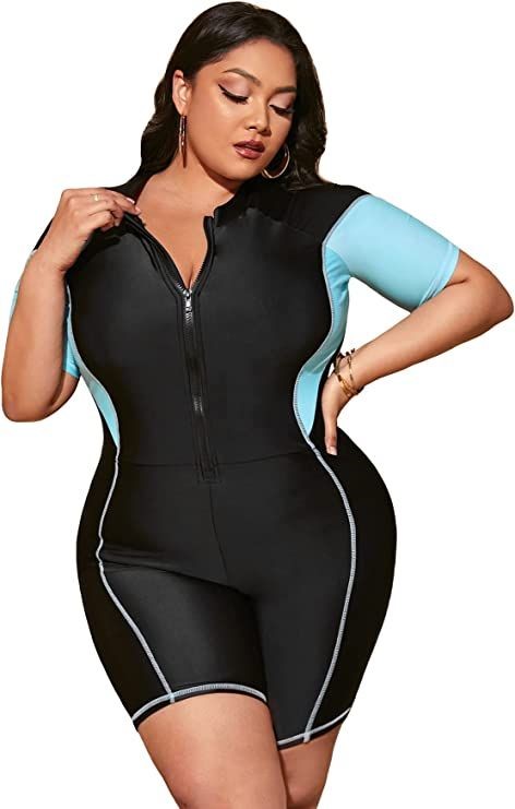 Plus size swimsuits featuring a black and aqua short-sleeve swim romper with a front zipper and contrast piping.