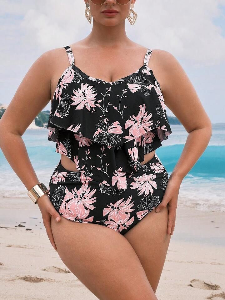 Plus size swimsuits featuring a black floral-print one-piece with pink flowers, a layered ruffle top, and side cutouts.