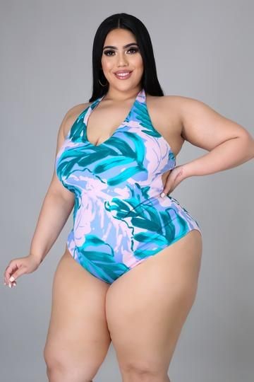 Plus size swimsuits featuring a pastel pink and turquoise tropical-print one-piece with a flattering halter neckline.