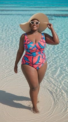 Plus size swimsuits featuring a red and turquoise tropical-print V-neck one-piece