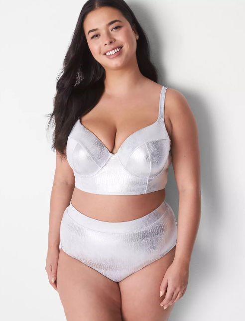Plus size swimsuits featuring a shimmering silver two-piece with a structured crop top and high-waisted bottoms.