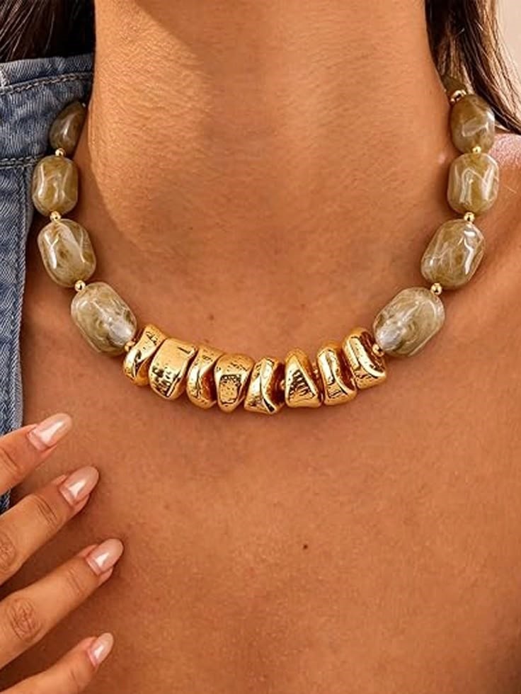 Statement Necklace Styling Guide featuring a beaded gold necklace that complements a scoop neckline