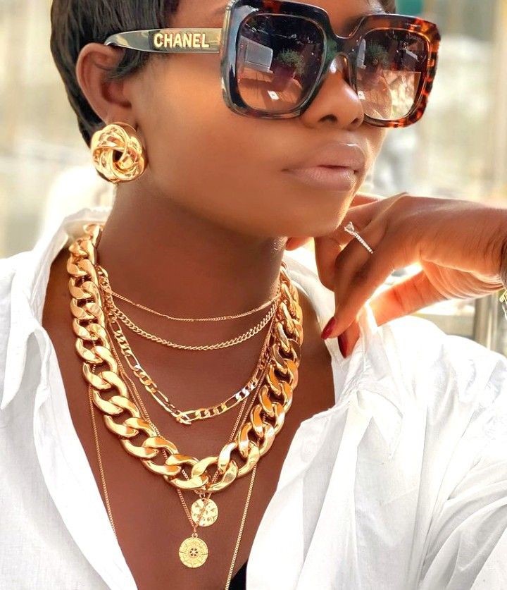 Statement Necklace Styling Guide showing layered gold necklaces with a white button-up shirt