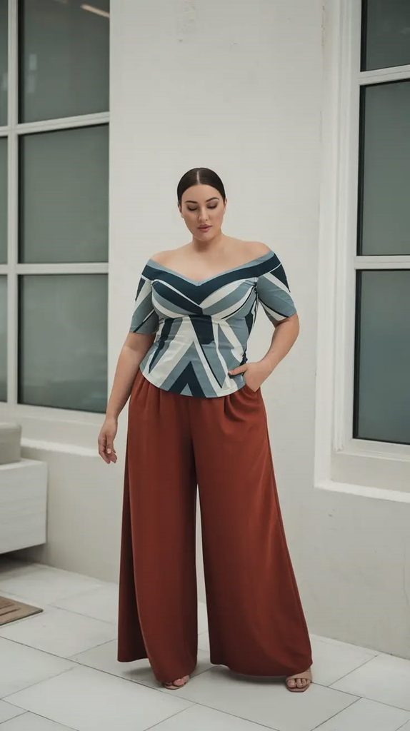 A stylish plus size outfit with a printed blouse and wide-leg pants