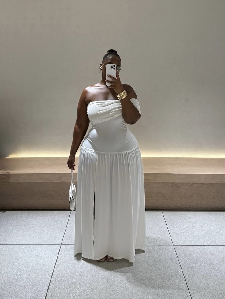 Plus size woman in a white maxi dress showing why your outfits feel off
